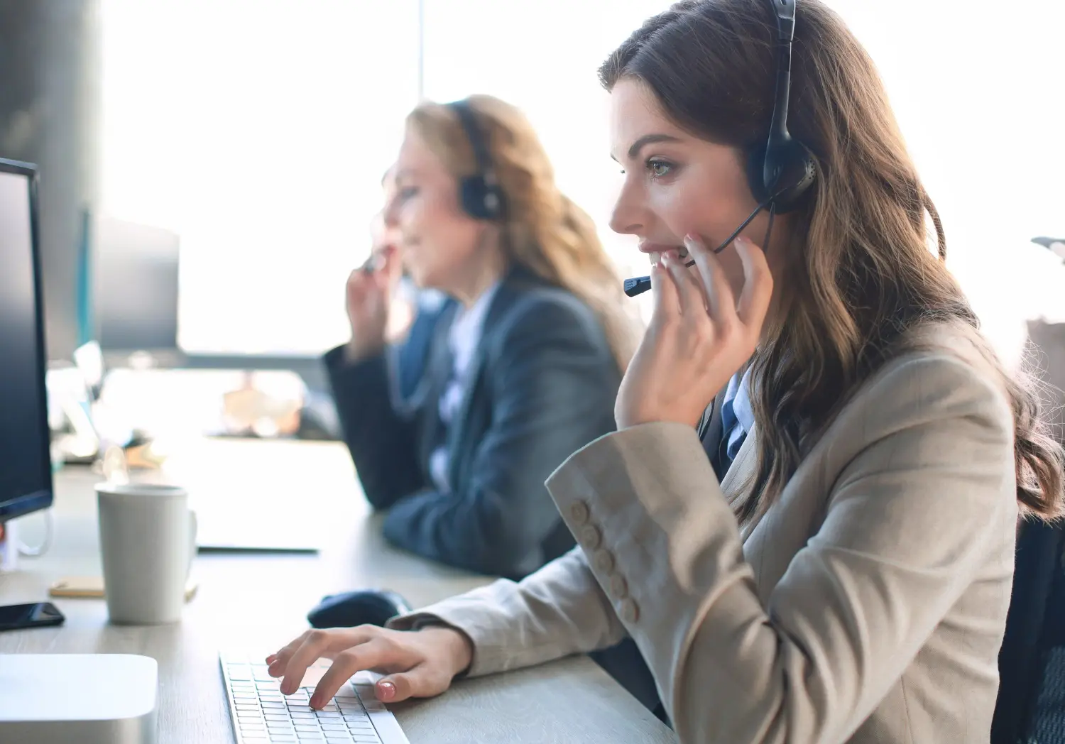 A U.S.-based HDM billing expert on a call in a modern office